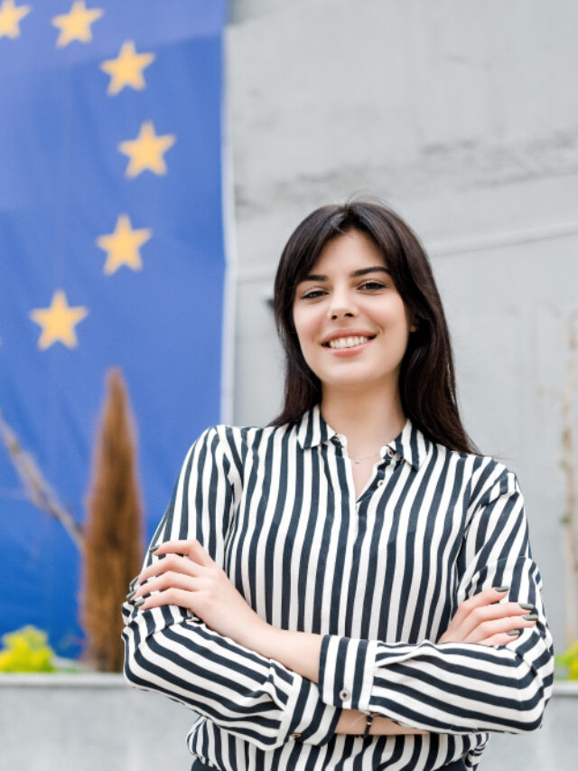 cropped-portrait-smiling-woman-with-european-union-flag.jpg